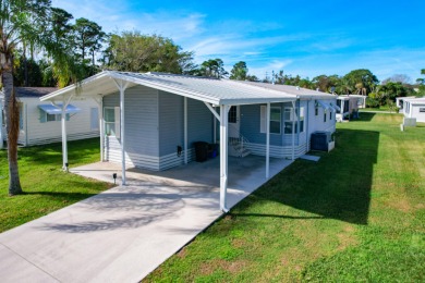Enjoy the fabulous space in this large 2 bed 2 bath home. Its on Spanish Lakes Golf Village in Florida - for sale on GolfHomes.com, golf home, golf lot