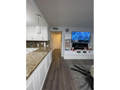 YOU WILL LOVE THIS PLACE! Cozy, clean, and modern condo in on Hillsboro Pines Golf in Florida - for sale on GolfHomes.com, golf home, golf lot