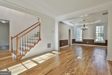 This lovely 4BR/3.5 BA Two-story home sits on a generous 1 acre on Canongate At Flat Creek Club in Georgia - for sale on GolfHomes.com, golf home, golf lot