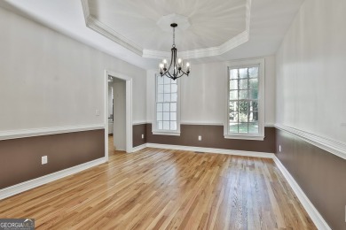 This lovely 4BR/3.5 BA Two-story home sits on a generous 1 acre on Canongate At Flat Creek Club in Georgia - for sale on GolfHomes.com, golf home, golf lot