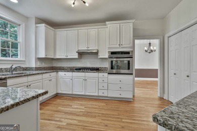 This lovely 4BR/3.5 BA Two-story home sits on a generous 1 acre on Canongate At Flat Creek Club in Georgia - for sale on GolfHomes.com, golf home, golf lot