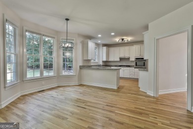 This lovely 4BR/3.5 BA Two-story home sits on a generous 1 acre on Canongate At Flat Creek Club in Georgia - for sale on GolfHomes.com, golf home, golf lot