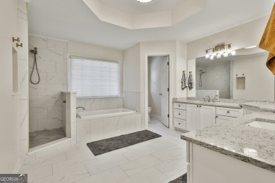 This lovely 4BR/3.5 BA Two-story home sits on a generous 1 acre on Canongate At Flat Creek Club in Georgia - for sale on GolfHomes.com, golf home, golf lot