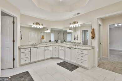 This lovely 4BR/3.5 BA Two-story home sits on a generous 1 acre on Canongate At Flat Creek Club in Georgia - for sale on GolfHomes.com, golf home, golf lot