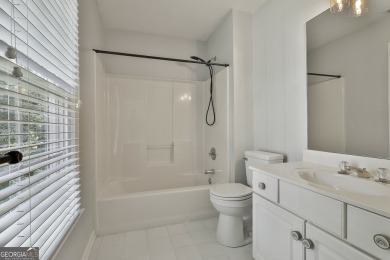 This lovely 4BR/3.5 BA Two-story home sits on a generous 1 acre on Canongate At Flat Creek Club in Georgia - for sale on GolfHomes.com, golf home, golf lot