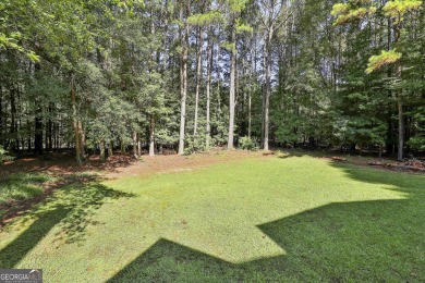 This lovely 4BR/3.5 BA Two-story home sits on a generous 1 acre on Canongate At Flat Creek Club in Georgia - for sale on GolfHomes.com, golf home, golf lot