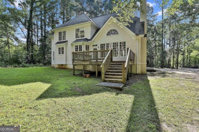 This lovely 4BR/3.5 BA Two-story home sits on a generous 1 acre on Canongate At Flat Creek Club in Georgia - for sale on GolfHomes.com, golf home, golf lot