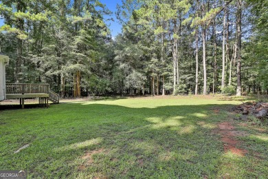 This lovely 4BR/3.5 BA Two-story home sits on a generous 1 acre on Canongate At Flat Creek Club in Georgia - for sale on GolfHomes.com, golf home, golf lot