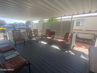 This cozy Park Model features a large front covered deck with a on Juniper Ridge R.V. Golf Resort in Arizona - for sale on GolfHomes.com, golf home, golf lot