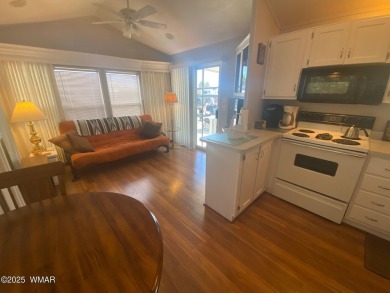 This cozy Park Model features a large front covered deck with a on Juniper Ridge R.V. Golf Resort in Arizona - for sale on GolfHomes.com, golf home, golf lot