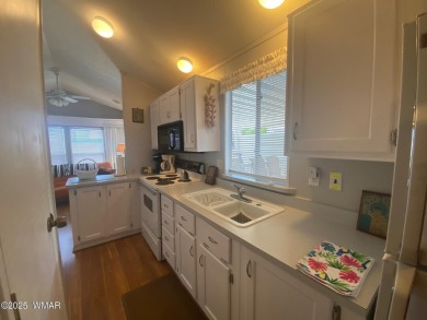 This cozy Park Model features a large front covered deck with a on Juniper Ridge R.V. Golf Resort in Arizona - for sale on GolfHomes.com, golf home, golf lot