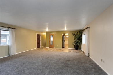 This one level home sits just off the 1st green of Lake Hills on Lake Hills Golf Course in Montana - for sale on GolfHomes.com, golf home, golf lot