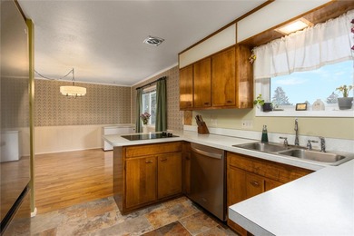 This one level home sits just off the 1st green of Lake Hills on Lake Hills Golf Course in Montana - for sale on GolfHomes.com, golf home, golf lot