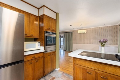 This one level home sits just off the 1st green of Lake Hills on Lake Hills Golf Course in Montana - for sale on GolfHomes.com, golf home, golf lot