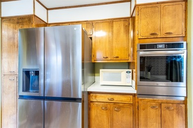 This one level home sits just off the 1st green of Lake Hills on Lake Hills Golf Course in Montana - for sale on GolfHomes.com, golf home, golf lot