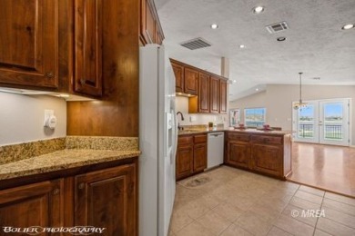 A resort style townhome overlooking the golf course driving on The Oasis Golf Club in Nevada - for sale on GolfHomes.com, golf home, golf lot