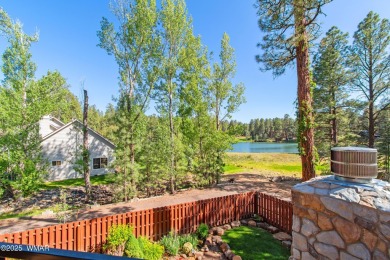 Discover timeless elegance and serene lake views in this on Pinetop Lakes Country Club in Arizona - for sale on GolfHomes.com, golf home, golf lot