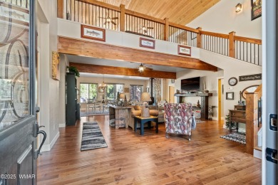 Discover timeless elegance and serene lake views in this on Pinetop Lakes Country Club in Arizona - for sale on GolfHomes.com, golf home, golf lot