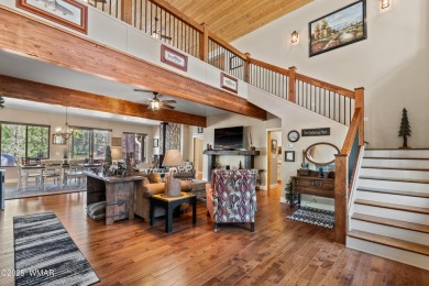 Discover timeless elegance and serene lake views in this on Pinetop Lakes Country Club in Arizona - for sale on GolfHomes.com, golf home, golf lot
