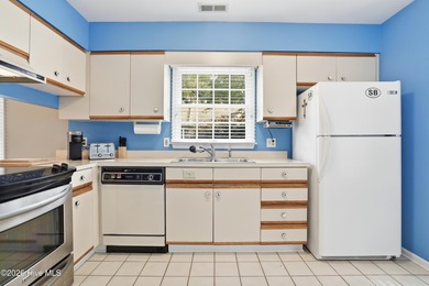 This inviting townhome located in The Woods section of Sea Trail on Sea Trail Golf Resort in North Carolina - for sale on GolfHomes.com, golf home, golf lot