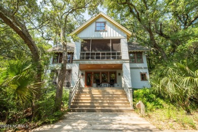 This 4BR, 3.5BA reverse floorplan tucked among mature oaks has on Bald Head Island Golf Club in North Carolina - for sale on GolfHomes.com, golf home, golf lot