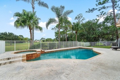 Spacious 5-bedroom, 4-bath, two-story home on a 1-acre lot in on PGA National Estates Golf Course in Florida - for sale on GolfHomes.com, golf home, golf lot