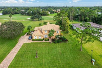 Spacious 5-bedroom, 4-bath, two-story home on a 1-acre lot in on PGA National Estates Golf Course in Florida - for sale on GolfHomes.com, golf home, golf lot