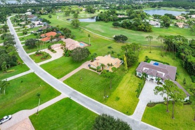 Spacious 5-bedroom, 4-bath, two-story home on a 1-acre lot in on PGA National Estates Golf Course in Florida - for sale on GolfHomes.com, golf home, golf lot