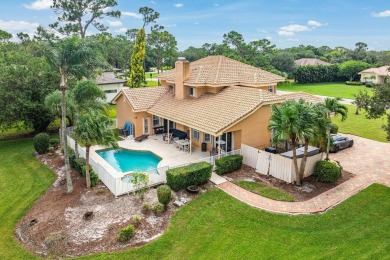 Spacious 5-bedroom, 4-bath, two-story home on a 1-acre lot in on PGA National Estates Golf Course in Florida - for sale on GolfHomes.com, golf home, golf lot