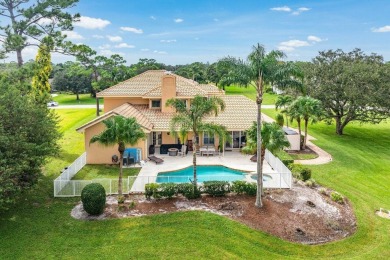 Spacious 5-bedroom, 4-bath, two-story home on a 1-acre lot in on PGA National Estates Golf Course in Florida - for sale on GolfHomes.com, golf home, golf lot