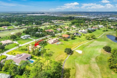 Spacious 5-bedroom, 4-bath, two-story home on a 1-acre lot in on PGA National Estates Golf Course in Florida - for sale on GolfHomes.com, golf home, golf lot