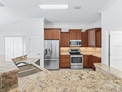 One or more photo(s) has been virtually staged. This inviting on Amberwood Executive Golf Course in Florida - for sale on GolfHomes.com, golf home, golf lot