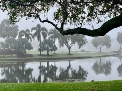 Spectacular golf and water views of this 12th ''island green'' on  in Florida - for sale on GolfHomes.com, golf home, golf lot