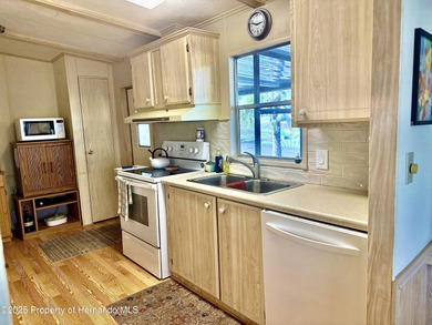 Beautifully maintained 2-bedroom, 2-bathroom home in the on High Point Golf Club, Inc. in Florida - for sale on GolfHomes.com, golf home, golf lot