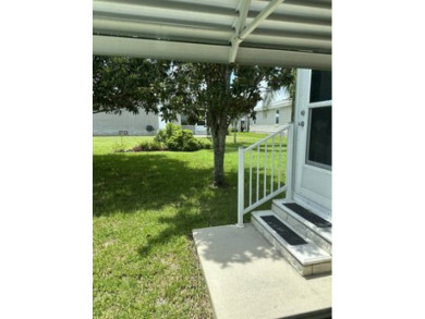 Beautiful 2/2 Palm Harbor. This 1296sf home with golf cart on Southport Springs Golf Club in Florida - for sale on GolfHomes.com, golf home, golf lot