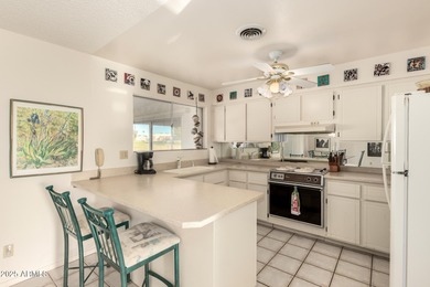 This gorgeous single-story home awaits you in the desirable 55+ on Fountain of the Sun Country Club in Arizona - for sale on GolfHomes.com, golf home, golf lot