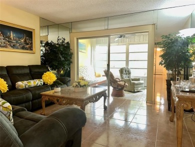Discover easy South Florida living in this beautifully updated on Oriole Golf and Tennis Club in Florida - for sale on GolfHomes.com, golf home, golf lot