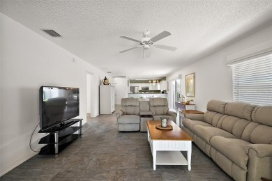 Welcome to this WATERFRONT 2/2 Marathon Courtyard Villa with a on The Links of Spruce Creek in Florida - for sale on GolfHomes.com, golf home, golf lot