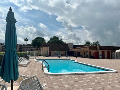 Discover easy South Florida living in this beautifully updated on Oriole Golf and Tennis Club in Florida - for sale on GolfHomes.com, golf home, golf lot