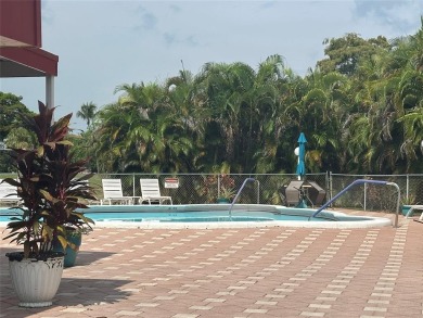 Discover easy South Florida living in this beautifully updated on Oriole Golf and Tennis Club in Florida - for sale on GolfHomes.com, golf home, golf lot