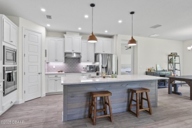 Better Than New - Modern Elegance with Premium Upgrades in on Halifax Plantation Golf Club in Florida - for sale on GolfHomes.com, golf home, golf lot