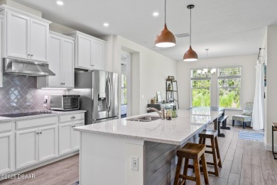 Better Than New - Modern Elegance with Premium Upgrades in on Halifax Plantation Golf Club in Florida - for sale on GolfHomes.com, golf home, golf lot