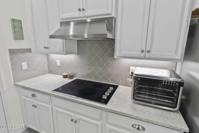 Better Than New - Modern Elegance with Premium Upgrades in on Halifax Plantation Golf Club in Florida - for sale on GolfHomes.com, golf home, golf lot