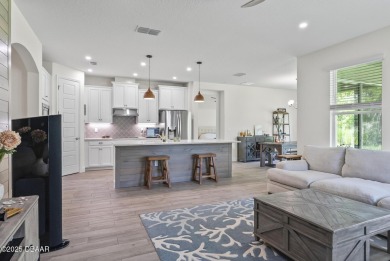 Better Than New - Modern Elegance with Premium Upgrades in on Halifax Plantation Golf Club in Florida - for sale on GolfHomes.com, golf home, golf lot