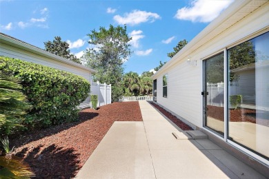 Welcome to this WATERFRONT 2/2 Marathon Courtyard Villa with a on The Links of Spruce Creek in Florida - for sale on GolfHomes.com, golf home, golf lot