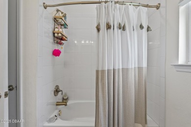 Better Than New - Modern Elegance with Premium Upgrades in on Halifax Plantation Golf Club in Florida - for sale on GolfHomes.com, golf home, golf lot