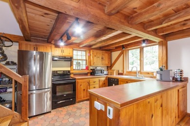 Tucked at the end of a quiet cul-de-sac, this post-and-beam cape on Eastman Golf Links in New Hampshire - for sale on GolfHomes.com, golf home, golf lot