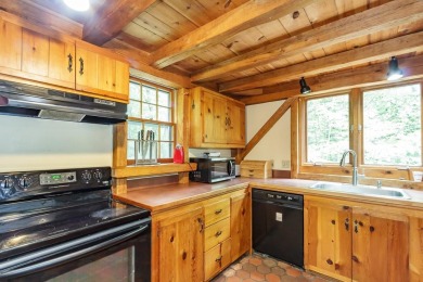 Tucked at the end of a quiet cul-de-sac, this post-and-beam cape on Eastman Golf Links in New Hampshire - for sale on GolfHomes.com, golf home, golf lot