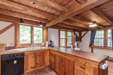 Tucked at the end of a quiet cul-de-sac, this post-and-beam cape on Eastman Golf Links in New Hampshire - for sale on GolfHomes.com, golf home, golf lot