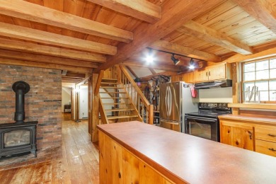 Tucked at the end of a quiet cul-de-sac, this post-and-beam cape on Eastman Golf Links in New Hampshire - for sale on GolfHomes.com, golf home, golf lot